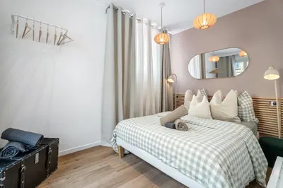 a bedroom with a bed and a mirror at Nice Renting - 35 Massena - Architect Flat Ultimate Charm Massena Center in Nice