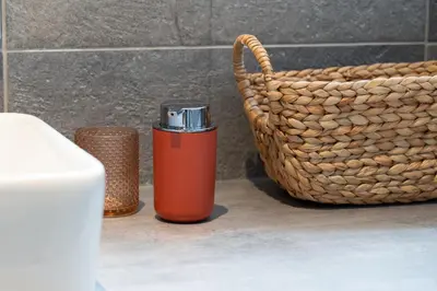 an orange thermos sitting next to a basket at Nice Renting - 35 Massena - Architect Flat Ultimate Charm Massena Center in Nice