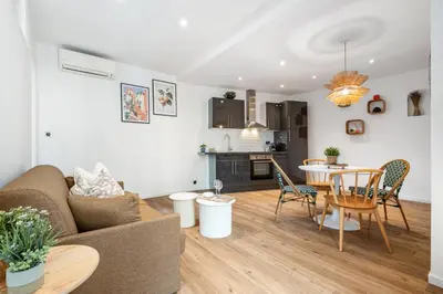 a living room with a couch and a table at Nice Renting - 35 Massena - Architect Flat Ultimate Charm Massena Center in Nice