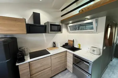 a small kitchen with a stove and a refrigerator at Nice studio in the heart of Old Nice - 4 pers in Nice