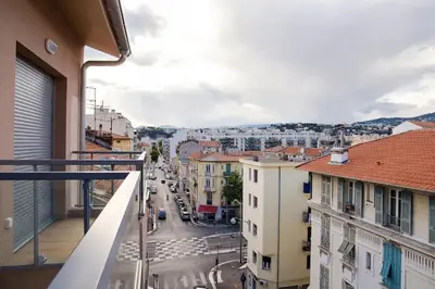 a view of a city street from a balcony at Studio climatisé au calme, mezzanine et balcon in Nice