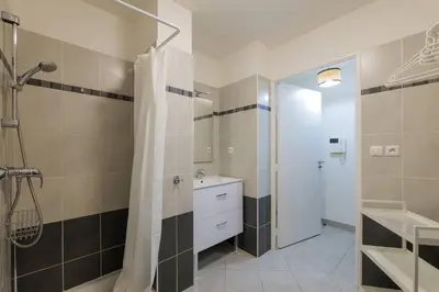 a bathroom with a shower and a sink at Studio au port de nice in Nice