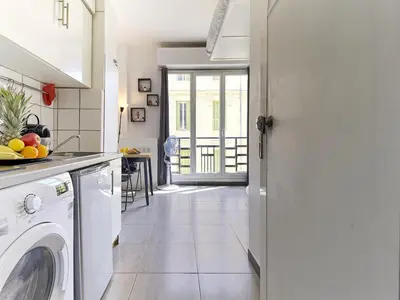 a kitchen with a washer and dryer in a room at Hyper Center - Superb Studio - Cozy - Wifi in Nice