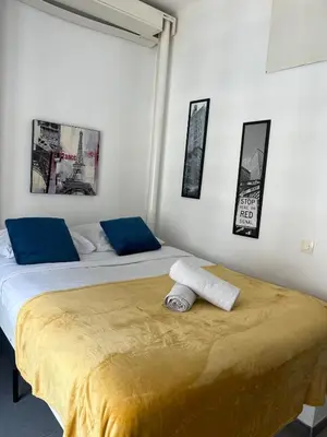 two beds sitting next to each other in a room at Hyper Center - Superb Studio - Cozy - Wifi in Nice