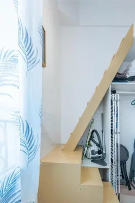 a staircase in a room with cardboard boxes at Blue Escape Nice in Nice