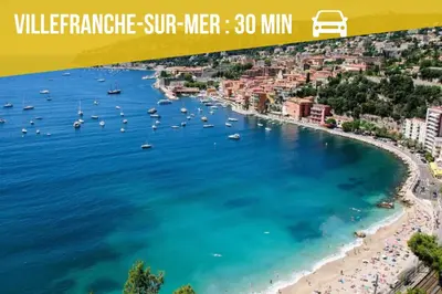 a view of a beach with boats in the water at Blue Escape Nice in Nice