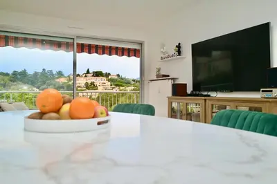 a bowl of fruit on a table in a living room at Beautiful 3-room apartment with terrace in Nice