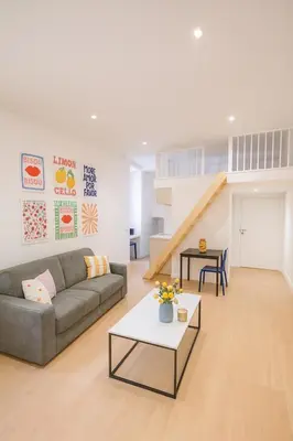 a living room with a couch and a table at Studio Masséna - Mer et Vieux Nice pour 4 personnes in Nice