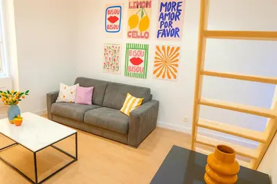 a living room with a couch and a table at Studio Masséna - Mer et Vieux Nice pour 4 personnes in Nice