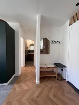 a living room with white walls and wooden floors at Beautiful 2-room, AC, Center, terrace in Nice