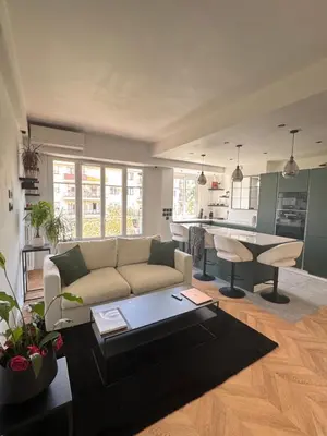 a living room with a couch and a table at Beautiful 2-room, AC, Center, terrace in Nice