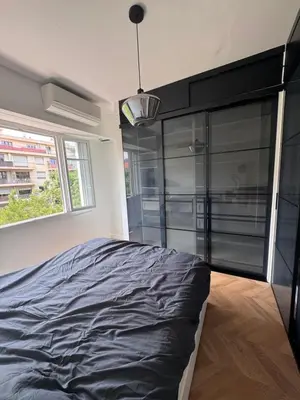 a bedroom with a large bed and a window at Beautiful 2-room, AC, Center, terrace in Nice