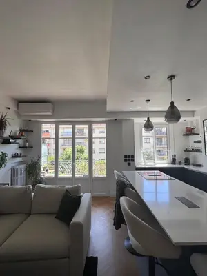 a living room with a couch and a table at Beautiful 2-room, AC, Center, terrace in Nice