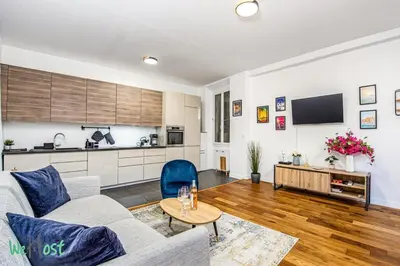 a living room with a couch and chairs and a table at WeHost - MALONAT - Urban Cocoon # Old Town & Beaches in Nice