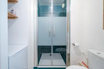 a shower with a glass door in a bathroom at Studio port de Nice Clim Balcon in Nice
