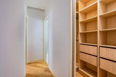 a room with wooden shelves and a closet at BAY VIEW AP4470 By Riviera Holiday Homes in Villefranche-sur-Mer