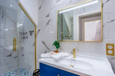 a bathroom with a sink and a mirror at BAY VIEW AP4470 By Riviera Holiday Homes in Villefranche-sur-Mer