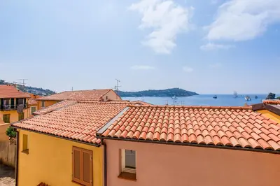 a view of the water from the roofs of buildings at BAY VIEW AP4470 By Riviera Holiday Homes in Villefranche-sur-Mer