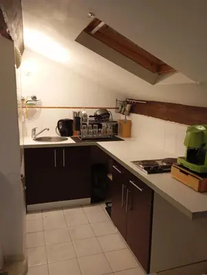 a kitchen with a sink and a counter top at Appartement meublé 265 in Nice