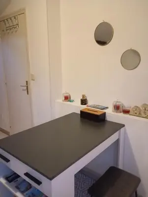 a kitchen with a black counter top in a room at Appartement meublé 265 in Nice