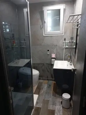 a bathroom with a toilet and a sink and a mirror at Nice Signature Caucade in Nice