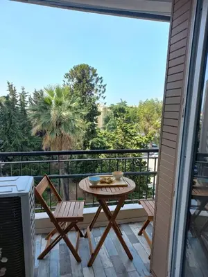 a patio with a table and chairs on a balcony at Nice Signature Caucade in Nice
