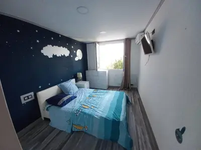a small bedroom with a bed and a window at Nice Signature Caucade in Nice