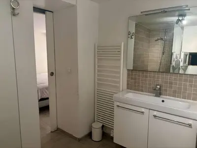 a bathroom with a sink and a mirror at Nice Signature Bellet in Nice
