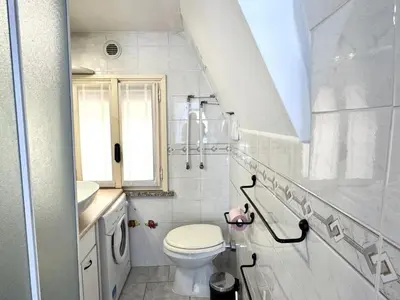 a white bathroom with a toilet and a sink at A OT Cocon d Augustin Old Town Nice Center in Nice