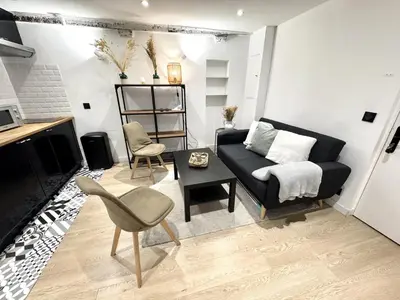 a living room with a couch and a table at B OT Le Cocon de la Prefecture - Old Town in Nice