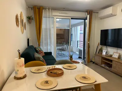 a kitchen with a sink and a stove top oven at Appartement neuf T2 calme avec terrasse - Proche Marché Liberation in Nice