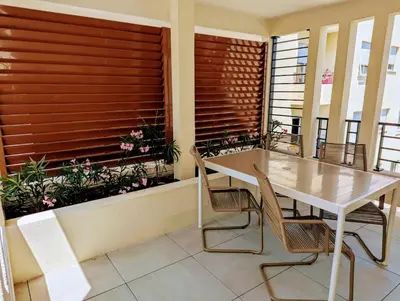 a balcony with a table and chairs and a window at Appartement neuf T2 calme avec terrasse - Proche Marché Liberation in Nice
