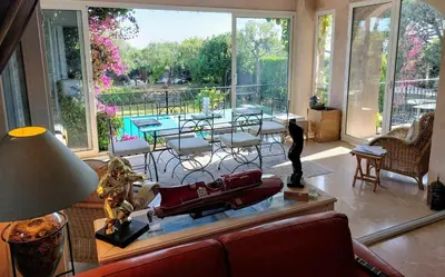 a living room with a boat on a table at Villa, Villefranche-sur-mer, Pool, Tennis Court, in Villefranche-sur-Mer