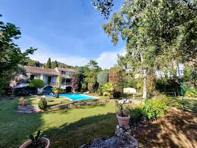 a yard with a swimming pool and a house at Villa, Villefranche-sur-mer, Pool, Tennis Court, in Villefranche-sur-Mer