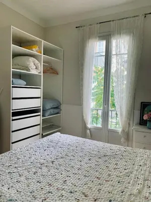 a bedroom with a bed and a window at Cocon chic au cœur de la ville in Nice