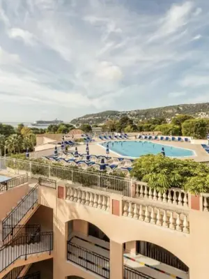 a view of the pool from the balcony of a hotel at Superbe 2 pièce tout confort - AC, piscine, Park in Villefranche-sur-Mer