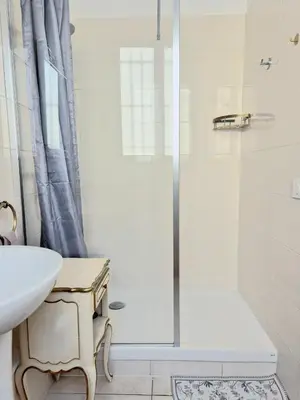 a bathroom with a shower and a sink at L'Appart by la Maïoun Guesthouse in Nice