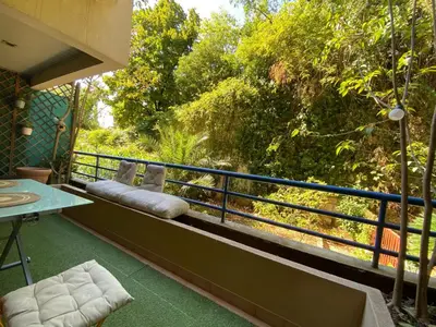 a living room with a couch and a table at Studio with Terrace near Beach in Nice