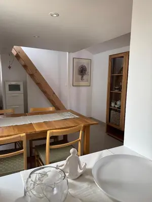 a kitchen and dining room with a table and a dining room at Renovated luxury cocoon Place Masséna in Nice