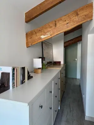 a room with a white counter and wooden beams at Renovated luxury cocoon Place Masséna in Nice