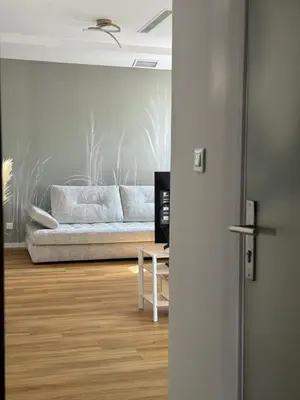 a living room with a couch and a table at Renovated luxury cocoon Place Masséna in Nice