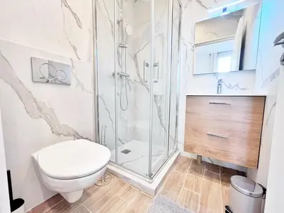 a bathroom with a toilet and a shower at RF 121 Close to port 2 bedrooms 2 toilets in Nice