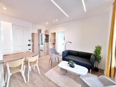 a living room with a couch and a table at RF 121 Close to port 2 bedrooms 2 toilets in Nice