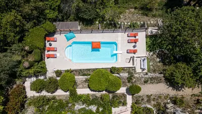 an aerial view of a house with a swimming pool at VILLA MONTE CRISTO - Villa conviviale a Nice - Superbe vue, piscine et jeux en plein air in Nice