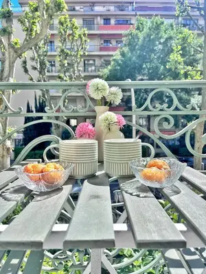 a picnic table with bowls of oranges on a balcony at Ref 118 Oliviera 2 Beds Apartment in Riquier in Nice