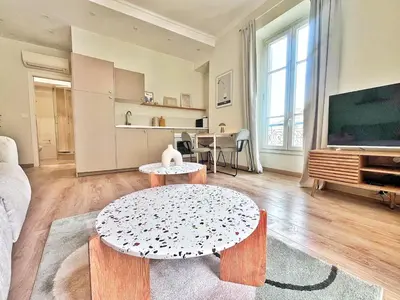 a living room with a couch and a table at Ref 119 - Slow Riviera T2 - Rue de France in Nice