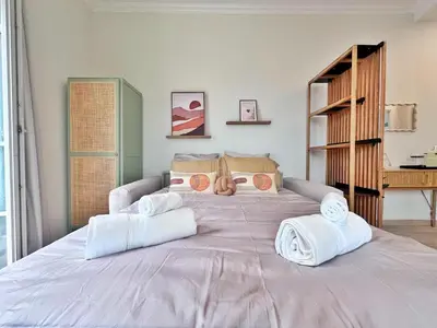 a bedroom with a large bed with towels on it at Ref 119 - Slow Riviera T2 - Rue de France in Nice