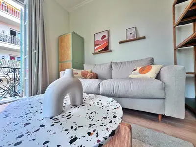 a living room with a couch and a table at Ref 119 - Slow Riviera T2 - Rue de France in Nice