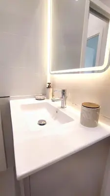 a bathroom with a white sink and a mirror at Ref 119 - Slow Riviera T2 - Rue de France in Nice