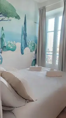 a bedroom with a white bed and a window at Ref 119 - Slow Riviera T2 - Rue de France in Nice